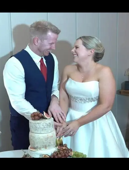 Wedding couple cutting cake