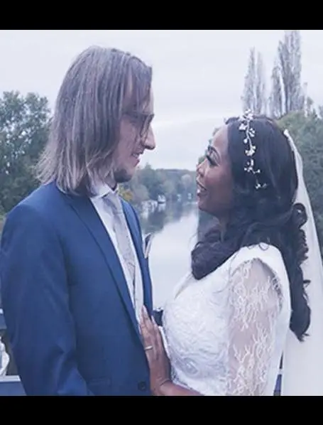married couple looking into each others arms